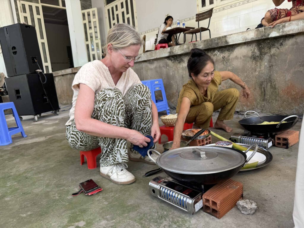 Guest cooking with a local family in the Mekong Delta