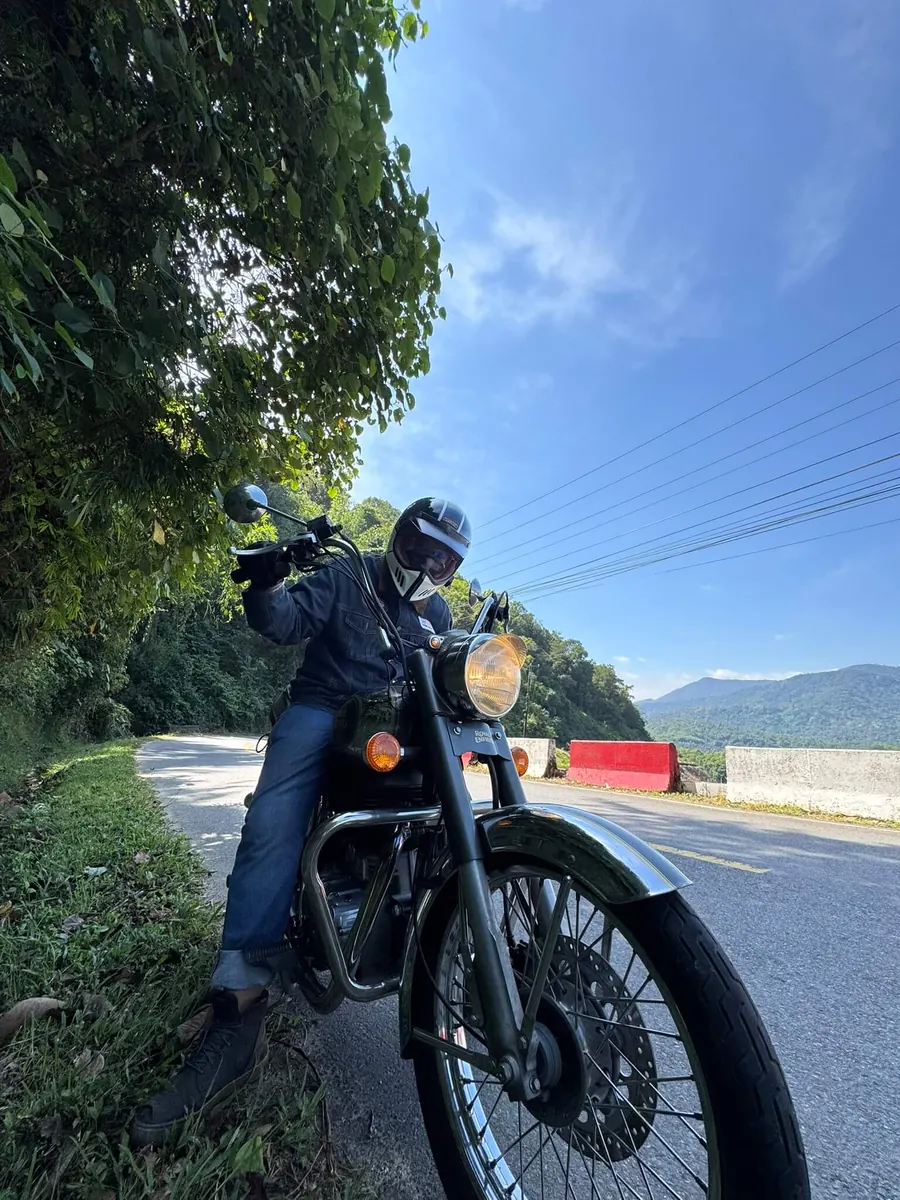 Nghi, co-founder of Trip Chip Travel, riding a motorbike in Southern Vietnam